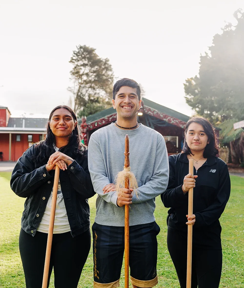 Some young people outside a marae